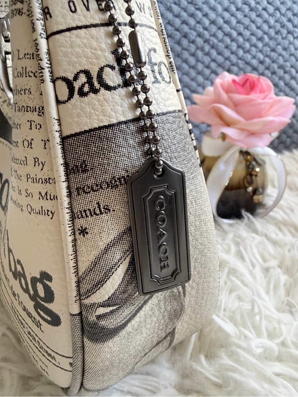Coach Mercer Metal Hangtag Featuring a Dark Gunmetal